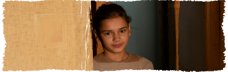 young girl with a small smiling