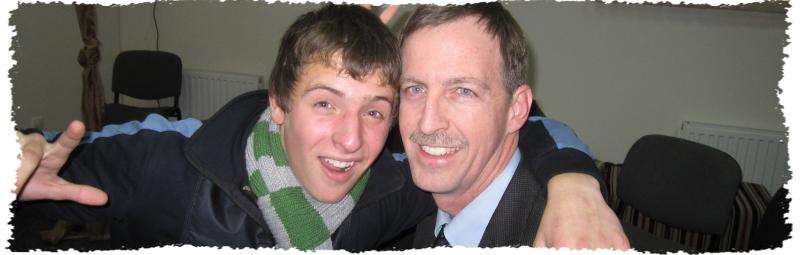 Two men in a group photo